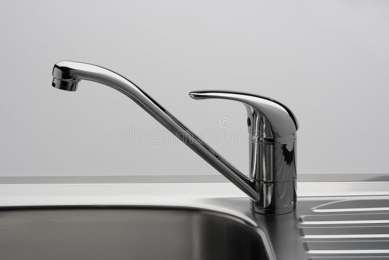 Water tap and sink in grey stock photo
