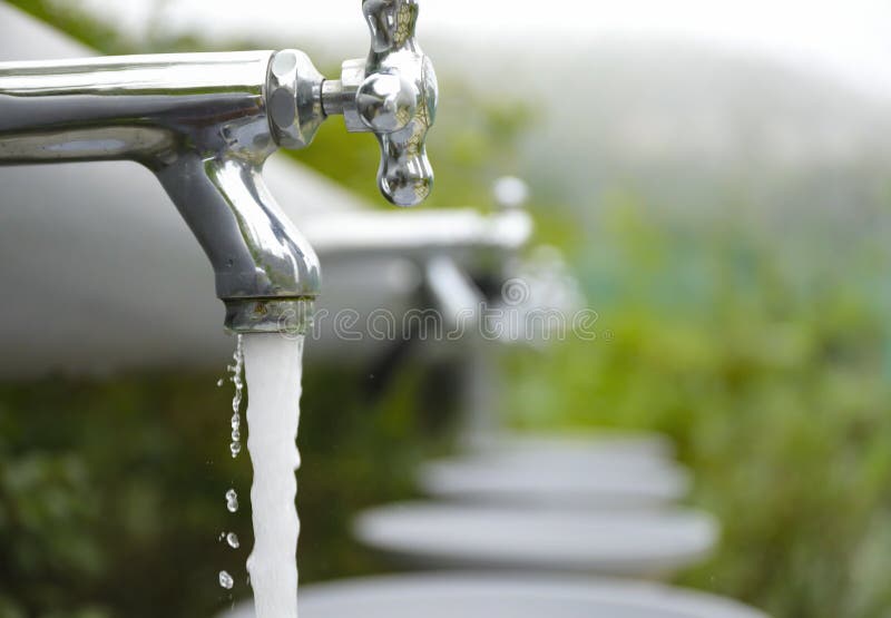 Water tap with water flow out from tap