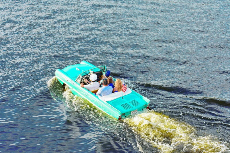 Water Taxi , Vintage Car, Funny People. Orlando, Florida ; July 31, 2018 royalty free stock image Water Taxi , Vintage Car, Funny People. Orlando, Florida ; July 31, 2018 royalty free stock image