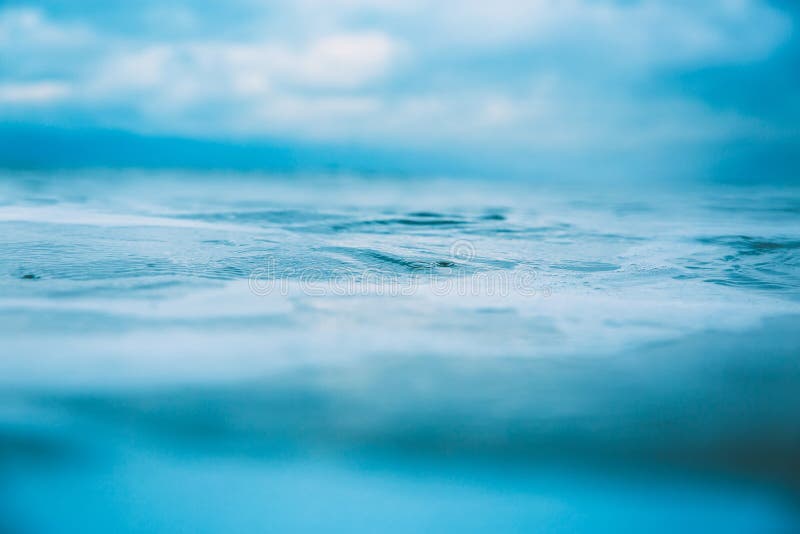 Water texture in ocean. Waves and foam in sea