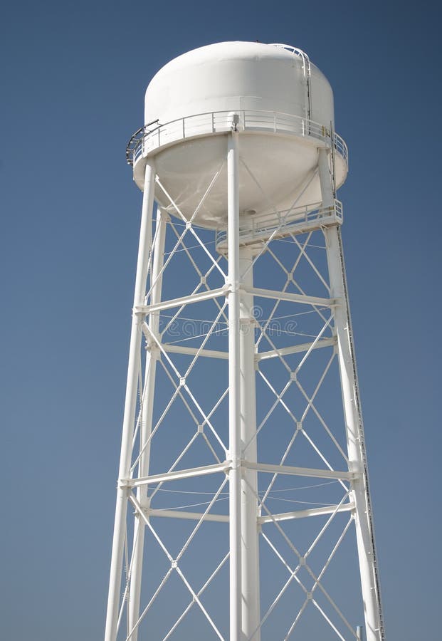 Water tower against clear blue sky