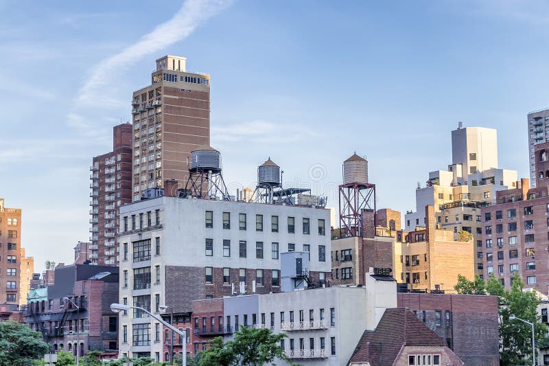View of Water towers or rooftop Water Tank on an Apartment Building in New York. Deposits typical of a rooftop in the city of New York, USA