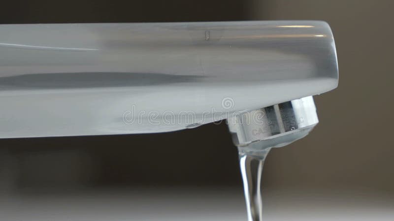 Water under weak pressure flows from a water tap