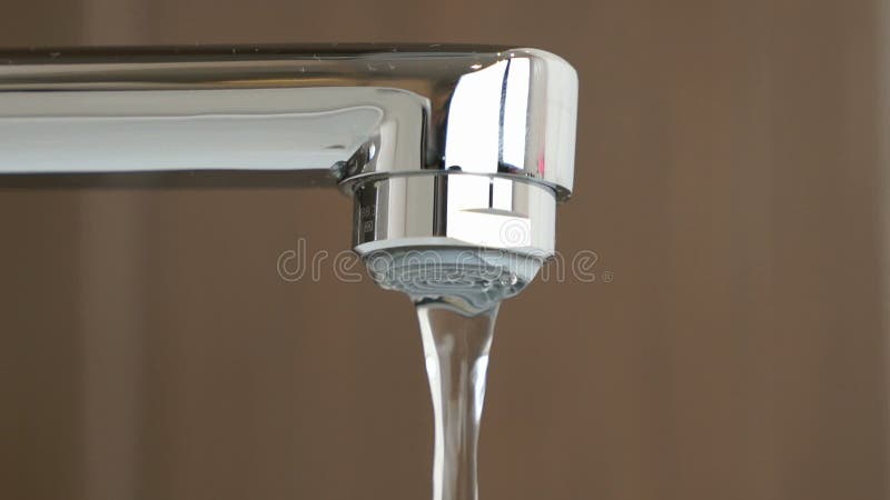 Water under weak pressure flows from a water tap