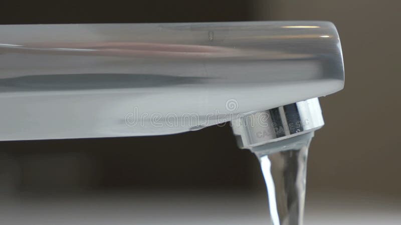 Water under weak pressure flows from a water tap