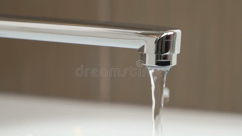 Water under weak pressure flows from a water tap