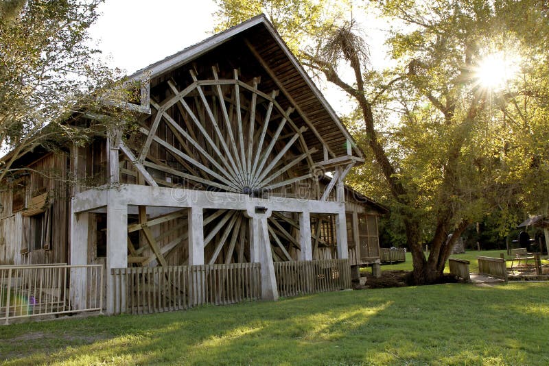 An old spanish sugar mill with water driven wooden wheel in De Leon Spring in Deland, florida. An old spanish sugar mill with water driven wooden wheel in De Leon Spring in Deland, florida