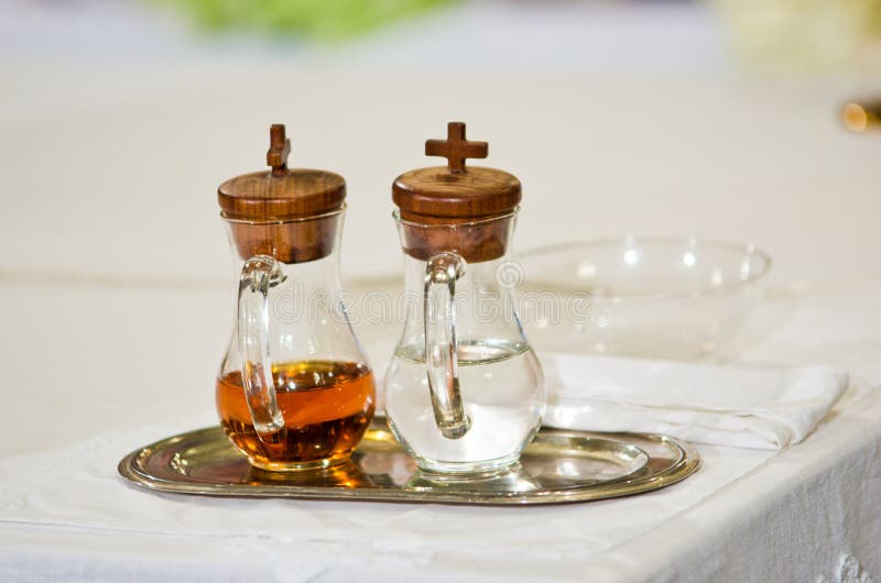 Water and holy wine in small ampoules on the altar ready for Holy Mass. Water and holy wine in small ampoules on the altar ready for Holy Mass