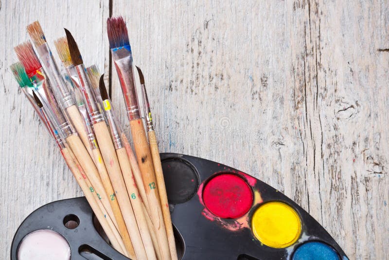 White Watercolor Palette. Empty Watercolor Tray Isolated on Wood