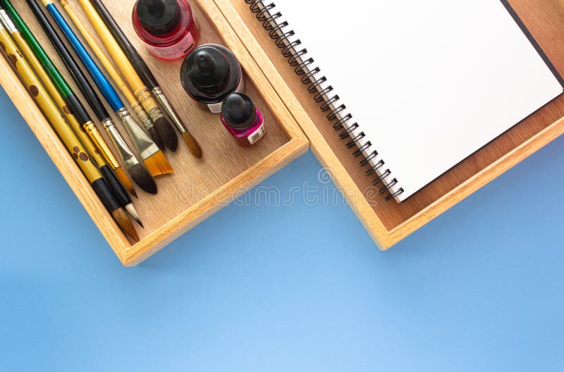 Blank Sketchbook On Wooden Table With Crayons Stock Photo