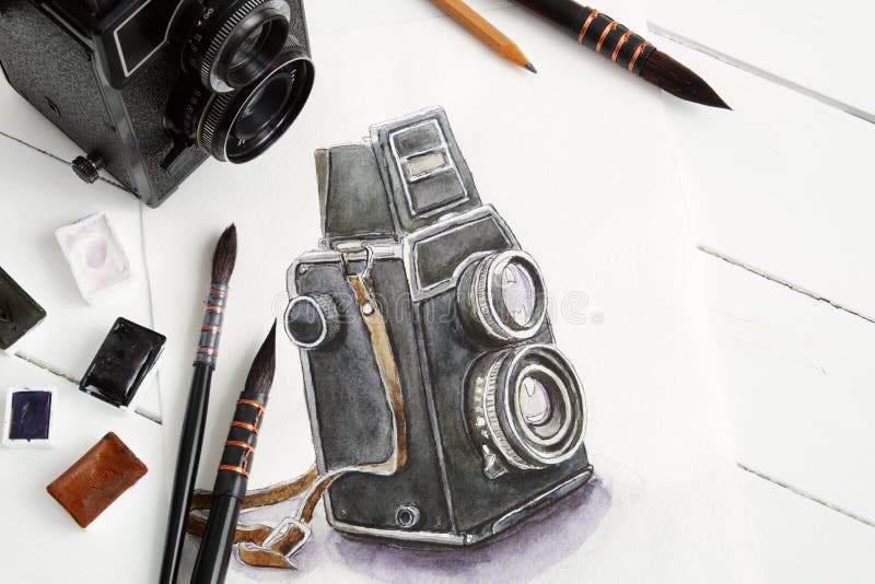Watercolor sketch of retro camera, old camera, brushes and paints.