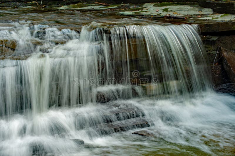 Waterfall cascading on the creek stock photo Waterfall cascading on the creek stock photo