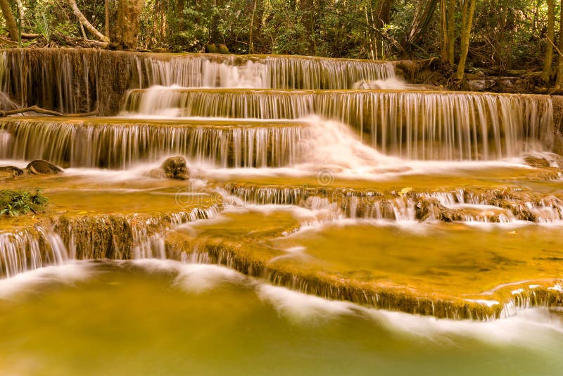Waterfall in deep forest jungle multiple layers stock image