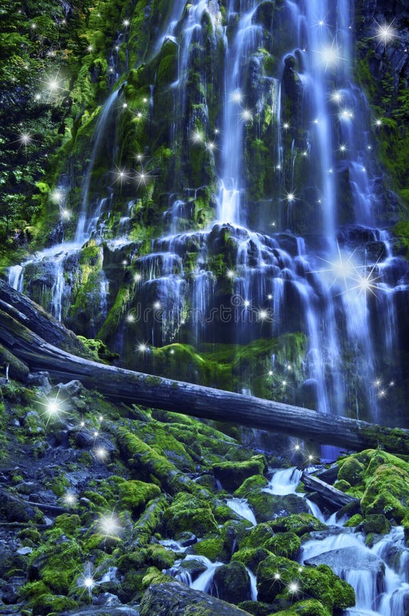 Waterfall with fairies and magical blue moonlight affect