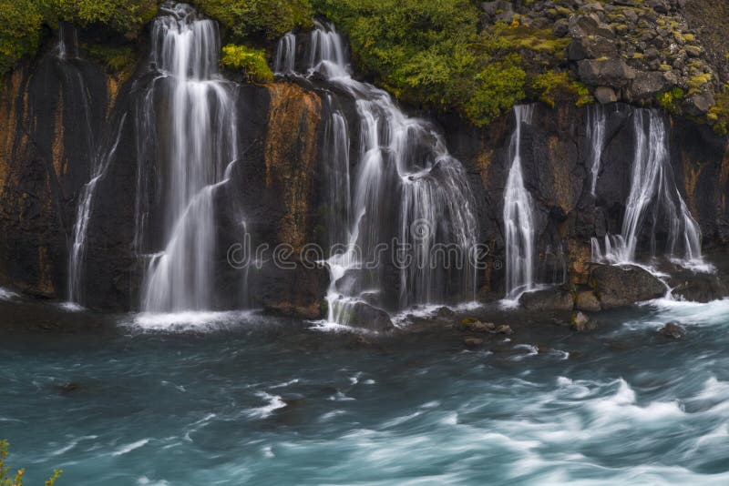 Waterfall flowing into blue river stock photography Waterfall flowing into blue river stock photography