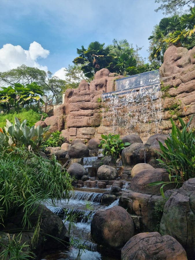 Man made waterfall in the middle of the garden. Man made waterfall stock images, royalty-free photos and pictures