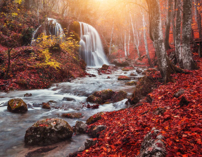 Waterfall At Mountain River In Autumn Forest At Sunset Stock Photo