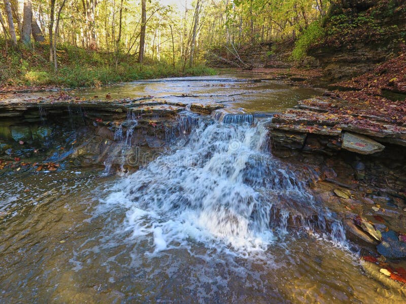Waterfall Over Flat Rocks in Fall Forest Stock Photo Image of creek, flowing 231432146