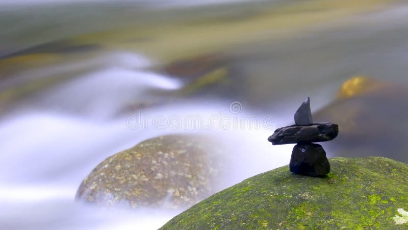 Waterfall with stone arrangeme