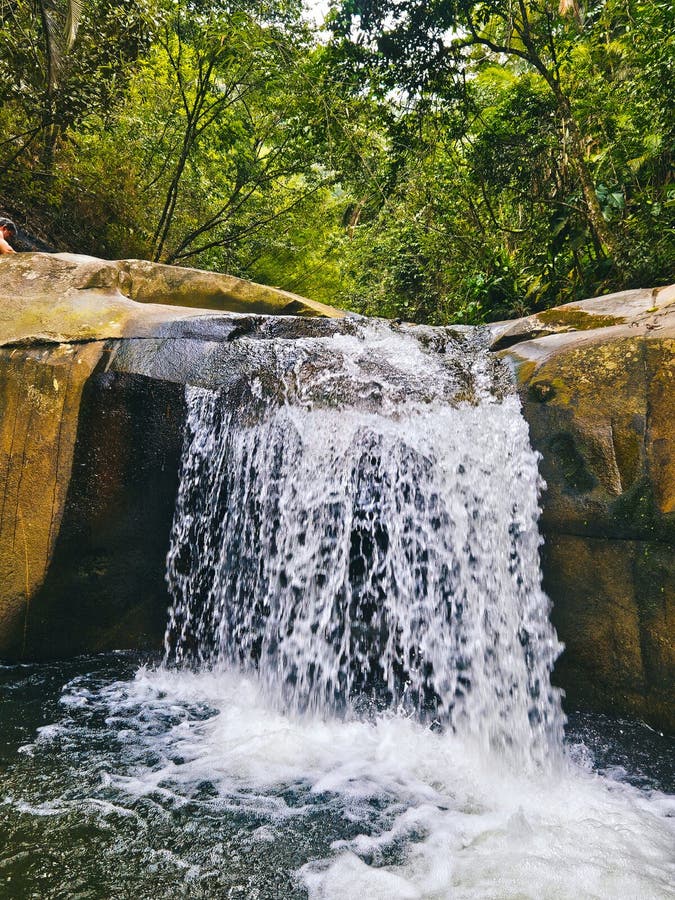 Waterfall in a stream with crystal-clear waters. Fountain waterfall clear stock images, royalty-free photos and pictures