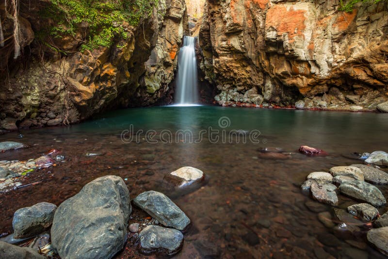 Waterfall Surrounded By Rocks Beautiful Landscape Foreground With