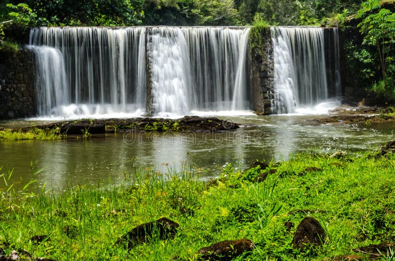 Waterfalls in Kauai Hawaii in green lush jungle
