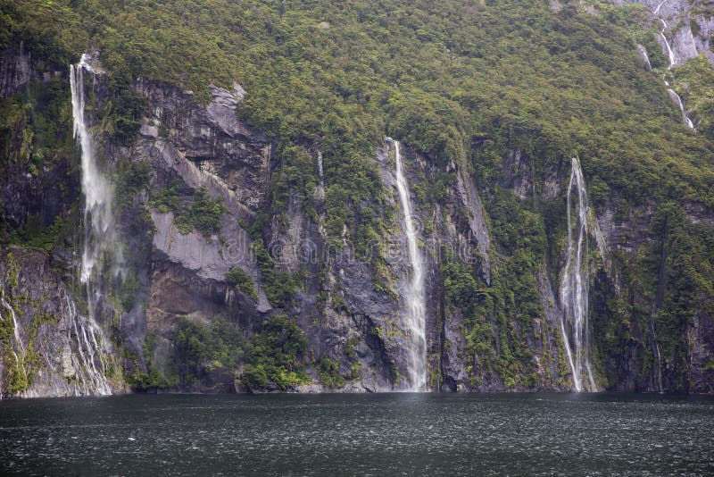 Waterfalls pooring down in Milford Sound