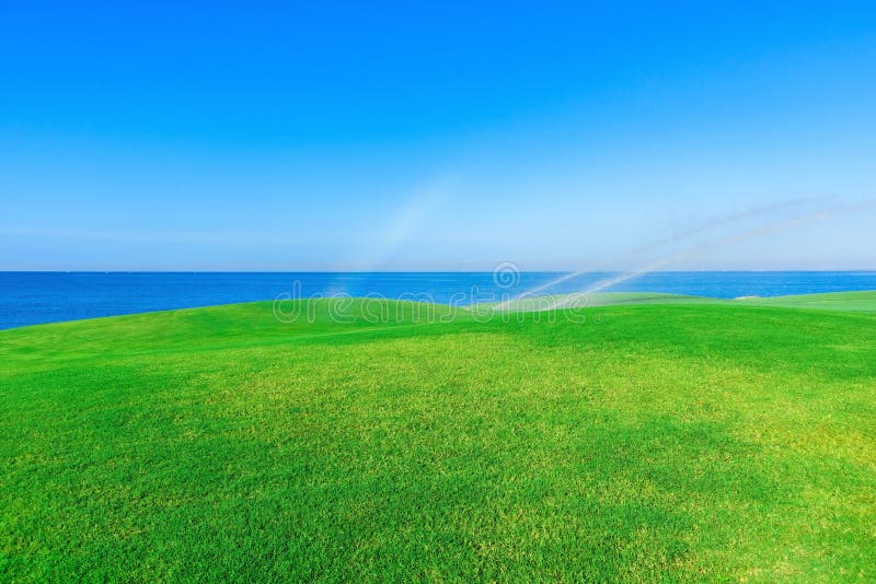 Watering the golf course stock image. Image of bunker 78834457