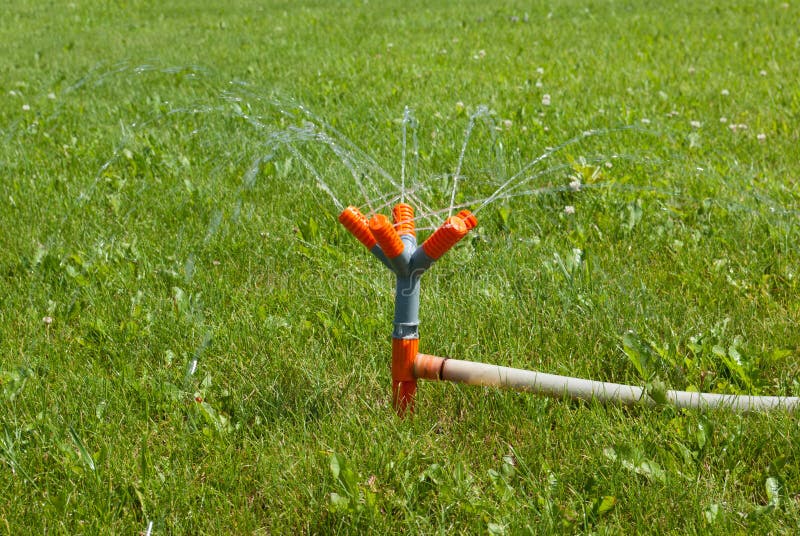 Watering the Green Lawns with Spray Pipe Stock Photo Image of
