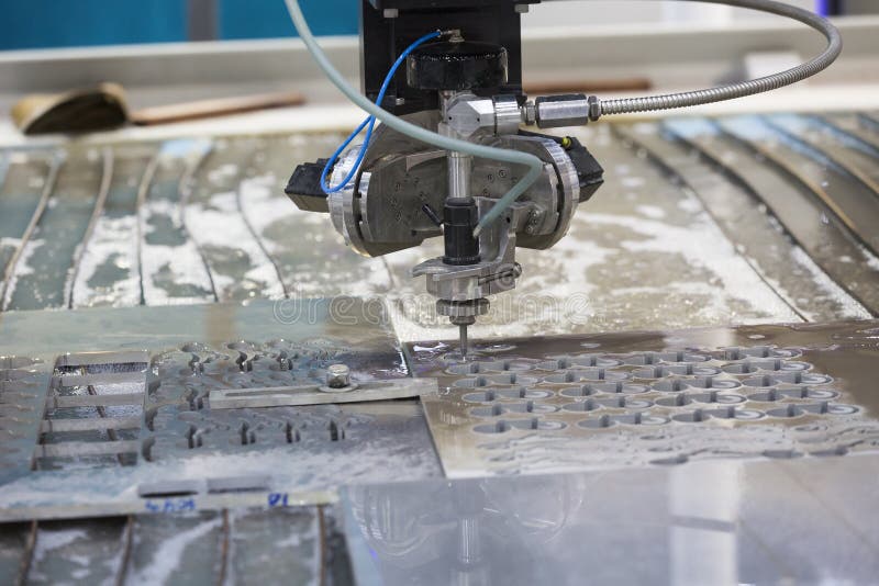 Waterjet metal cutting by cnc program stock image
