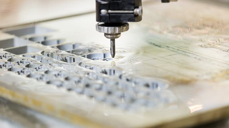 Waterjet metal cutting by cnc program royalty free stock photo