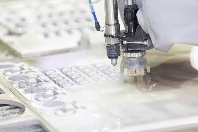 Waterjet metal cutting by cnc program royalty free stock photo