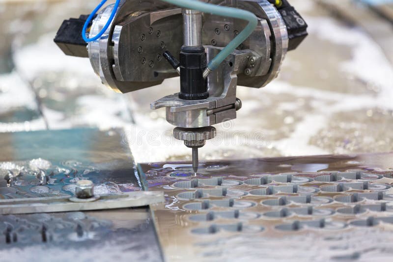 Waterjet metal cutting by cnc program royalty free stock photos