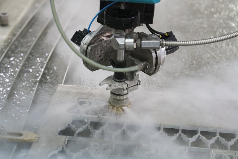 Waterjet metal cutting by cnc program royalty free stock images