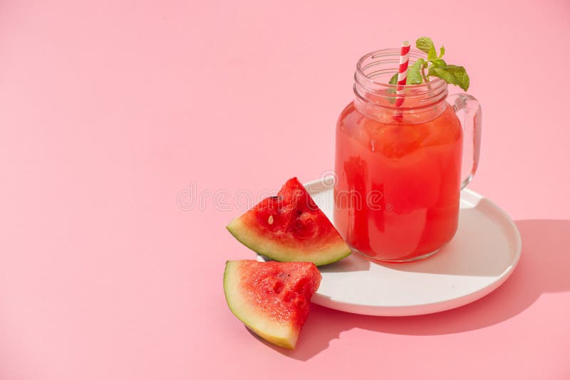 Watermelon juice on the pink background stock photos