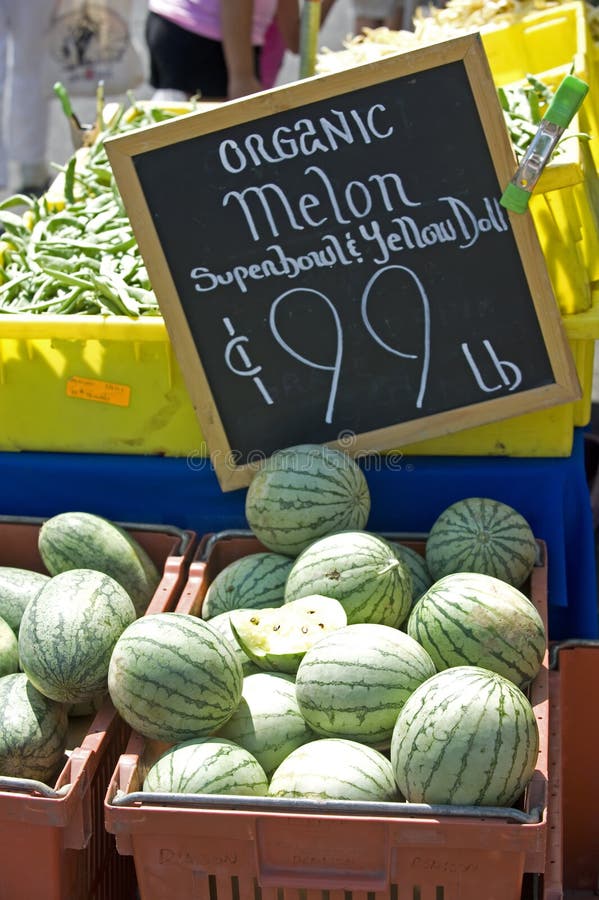 An assortment of fresh vegtables at a farmers market. Watermellon. An assortment of fresh vegtables at a farmers market. Watermellon.