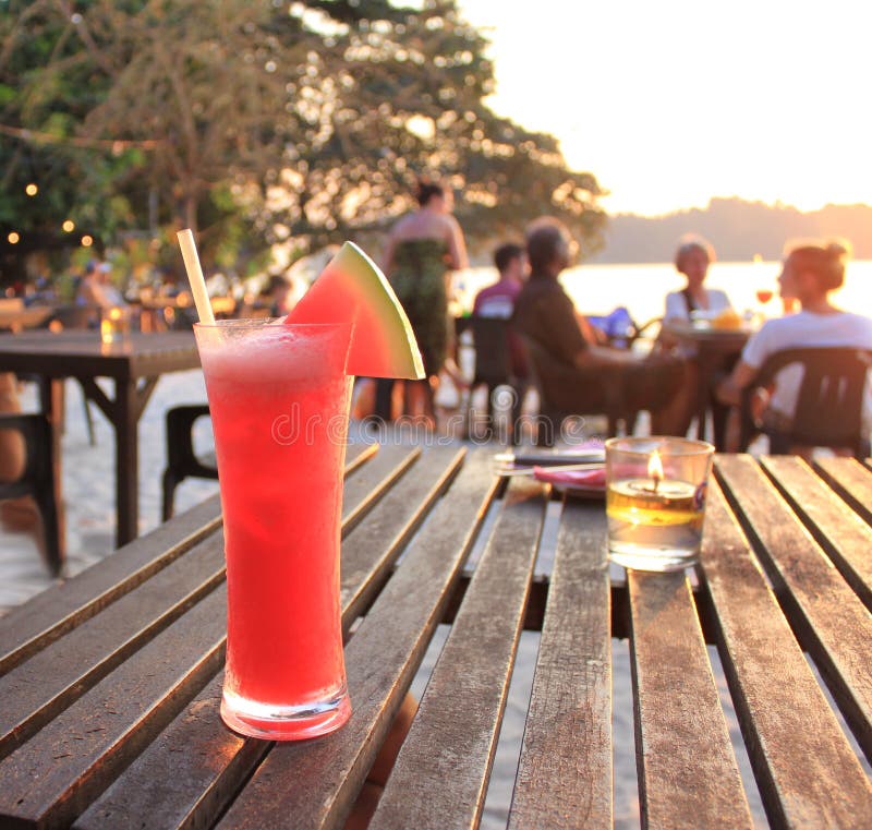 Fresh cold watermelon juice on the beach, open air cafe royalty free stock photo