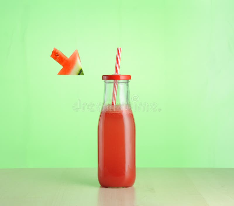 Watermelon juice in glass bottle royalty free stock photo
