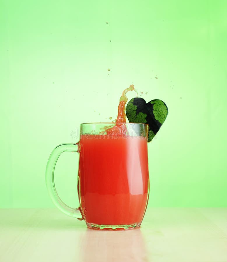 Watermelon juice in jug and heart form stock photo