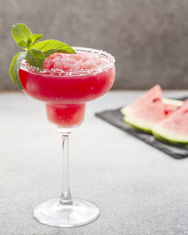 Watermelon margarita cocktail with lime. Watermelon summer cocktail with ice and mint leaves. royalty free stock image Watermelon margarita cocktail with lime. Watermelon summer cocktail with ice and mint leaves. royalty free stock image