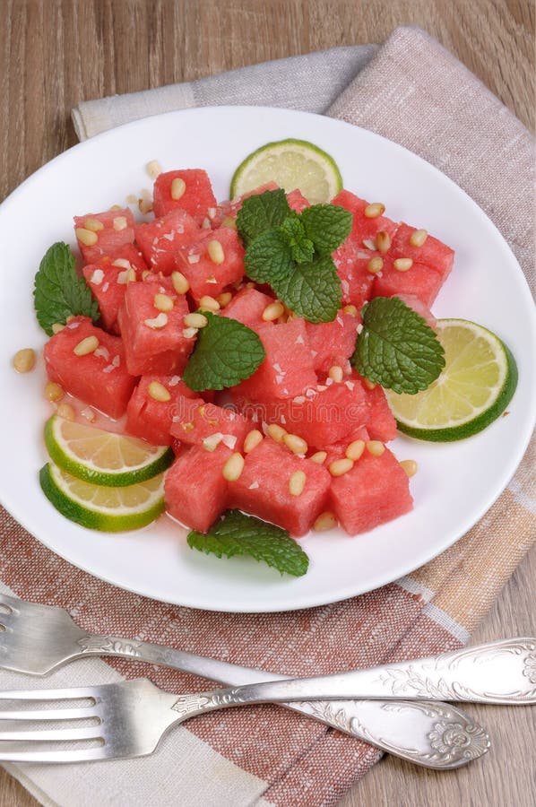 Watermelon salad with lime stock image. Image of piece 76671331