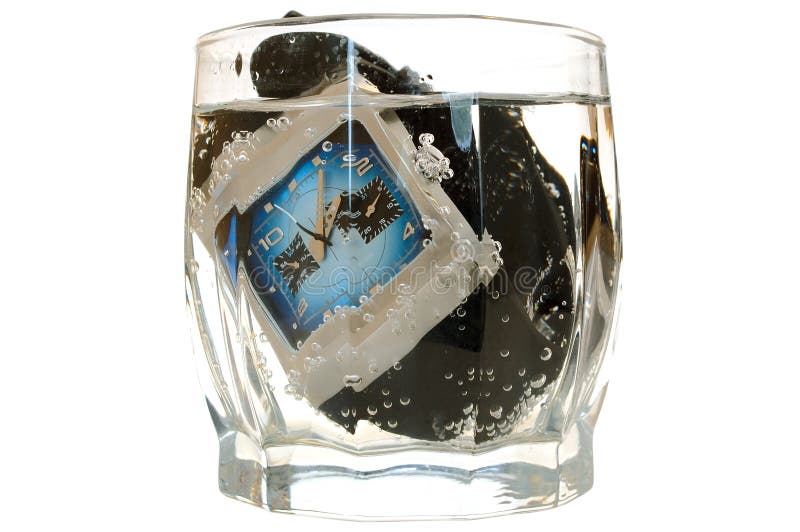 Waterproof watch in glass with water.