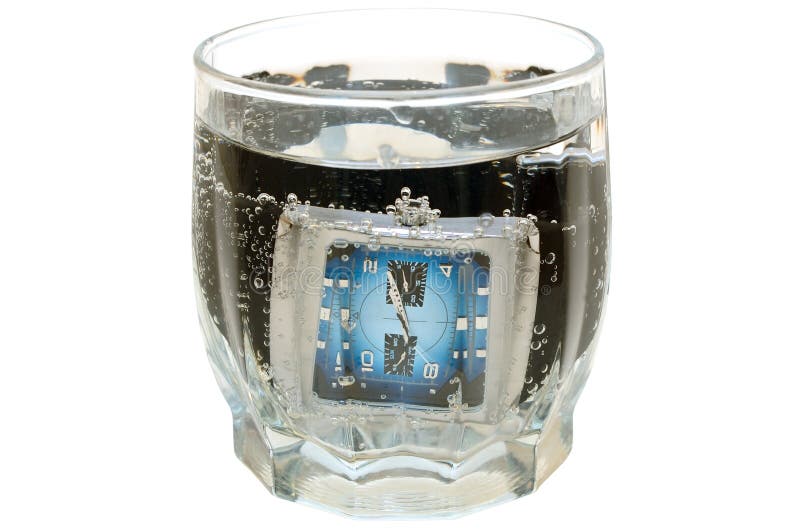 Waterproof watch in glass with water.