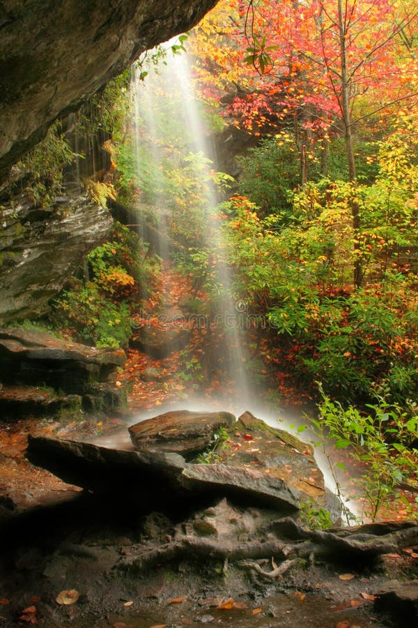 A waterfall during fall of the year. Captured on a rainy day. A waterfall during fall of the year. Captured on a rainy day.