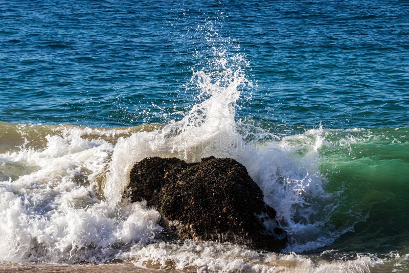 Wave Breaking on Rock Near Shore. Ocean in Background. Stock Photo ...