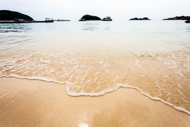 Wave of the sea on the sandy beach