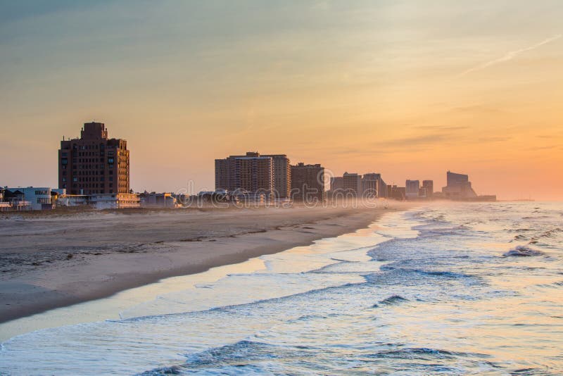 Waves in the Atlantic Ocean and Buildings at Sunrise, in Ventnor City ...