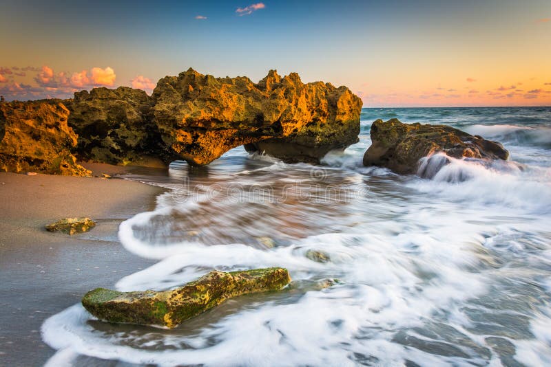 Waves and coral at sunrise in the Atlantic Ocean at Coral Cove Park, on Jupiter Island, Florida