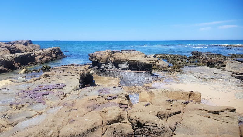 Waves crashing onto the rocky shoreline