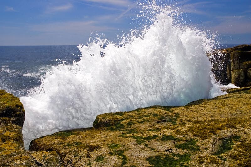 Waves crashing on rocks